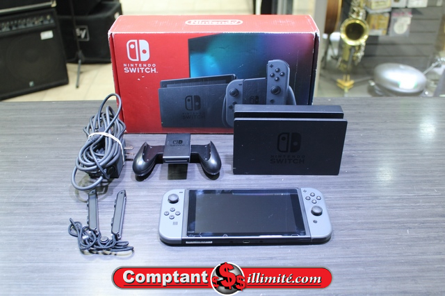 Console Nintendo switch + carte sd 64 go + boite (petite cassure) - Image 1